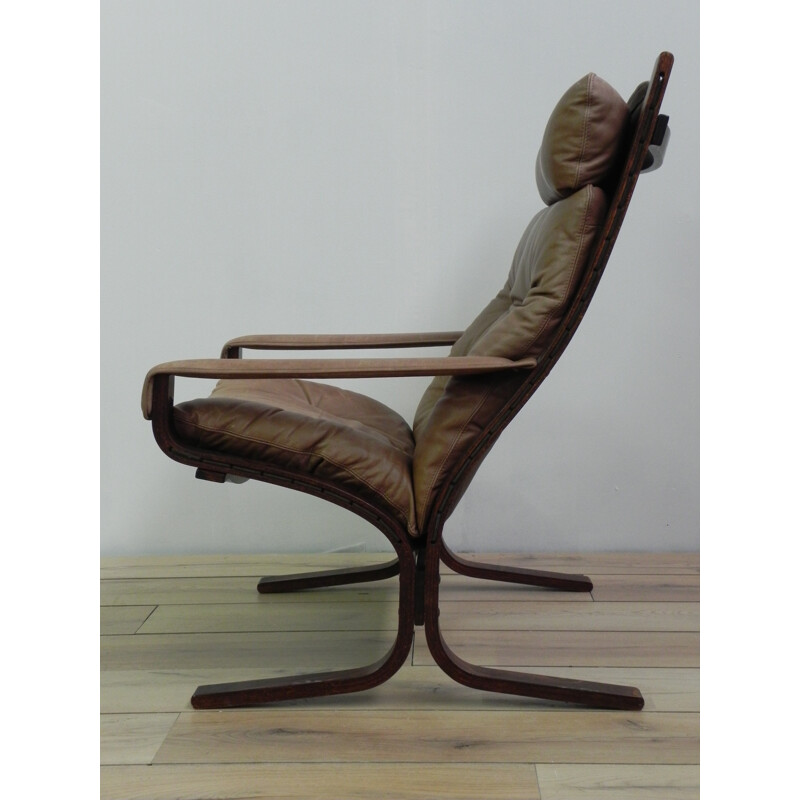 "Siesta" lounge chair in wood and brown leather - 1960s