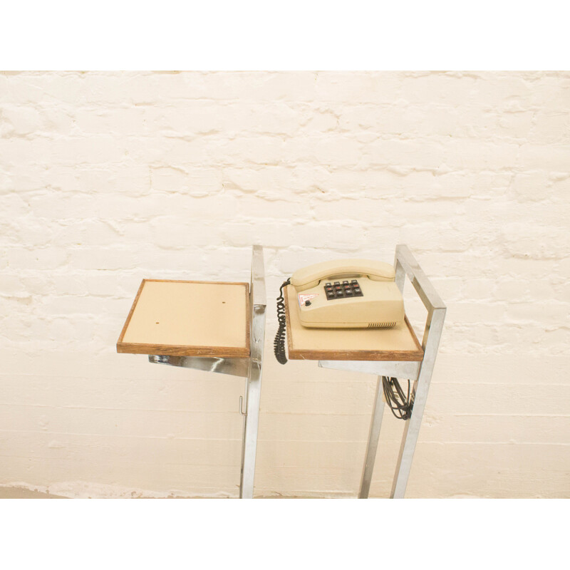 Vintage industrial telephone table on wheels