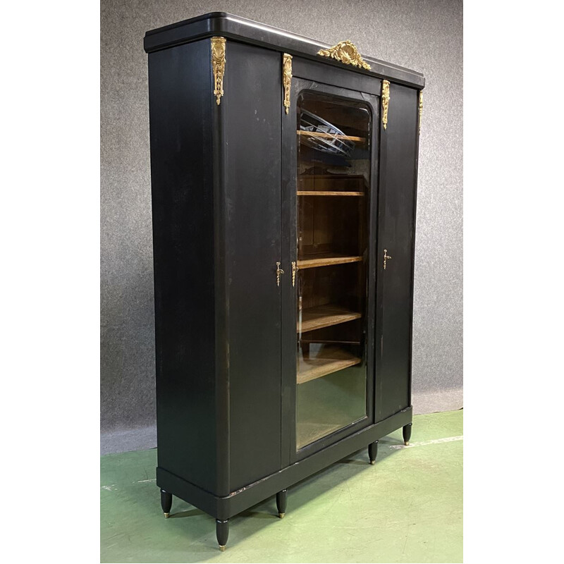 Vintage bookcase in matte black patina oak and bronze