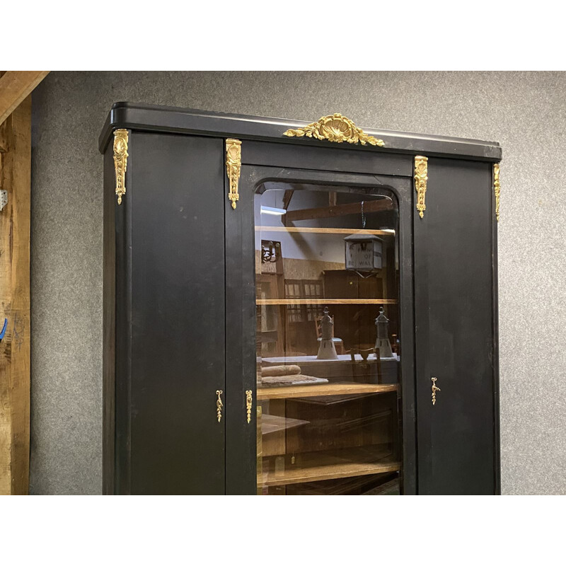 Vintage bookcase in matte black patina oak and bronze