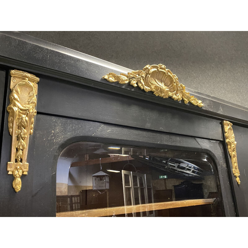 Vintage bookcase in matte black patina oak and bronze