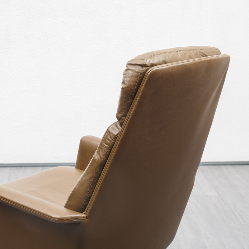 Vintage leather lounge chair with foot stool, COR, design Horst Brüninge dit Artikel 1960s 