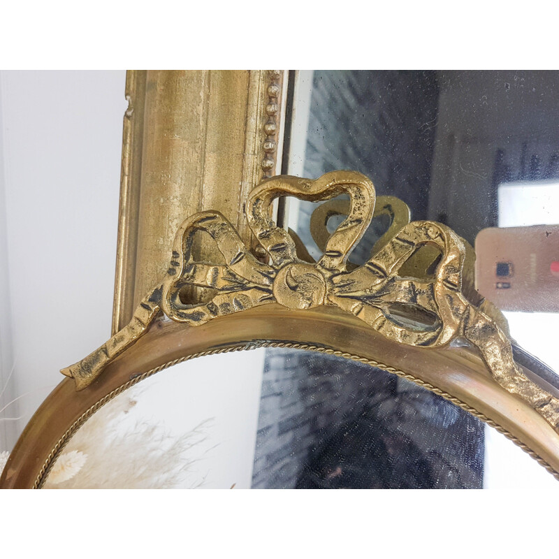 Vintage round brass mirror with 1950's golden bow