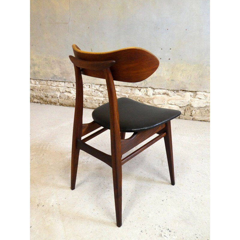 Vintage teak chair with sculptural backrest