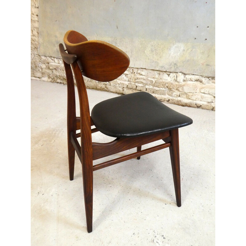 Vintage teak chair with sculptural backrest