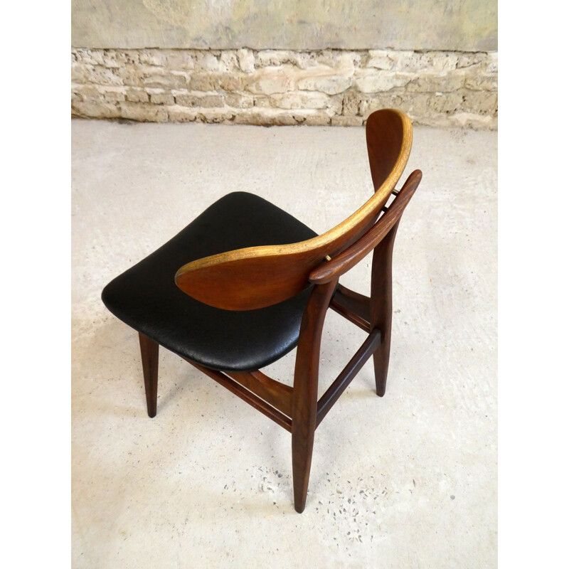 Vintage teak chair with sculptural backrest