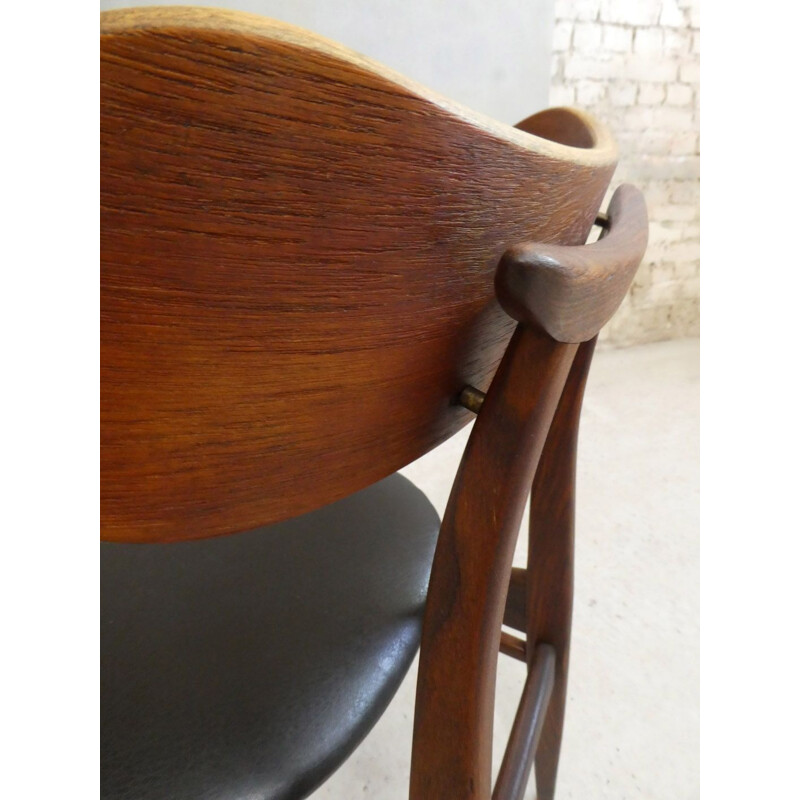 Vintage teak chair with sculptural backrest