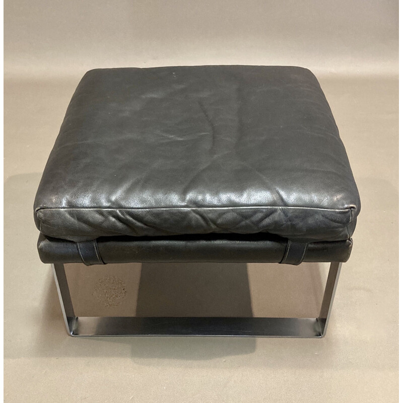 Vintage black leather sofa and its ottoman 1960