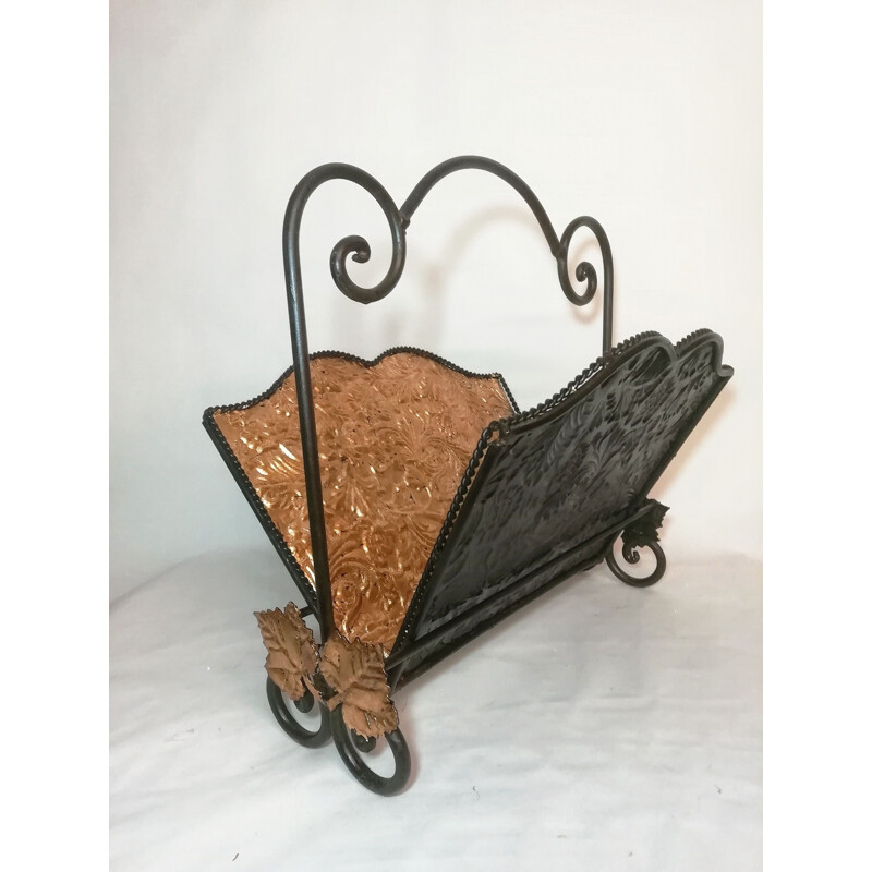 Vintage wrought iron folding magazine rack with patterned embossed interior