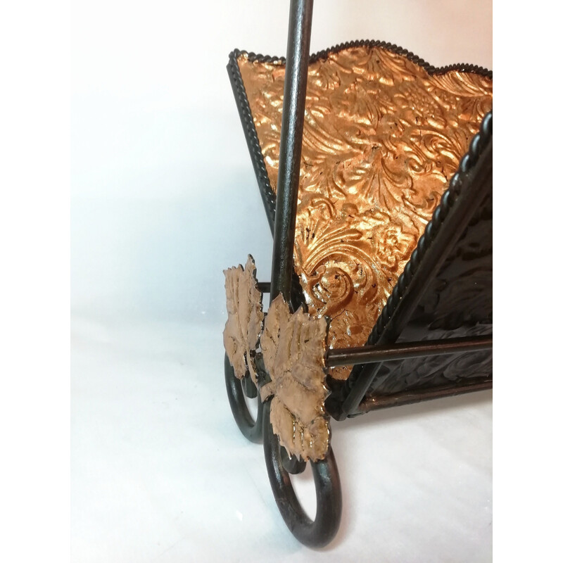 Vintage wrought iron folding magazine rack with patterned embossed interior