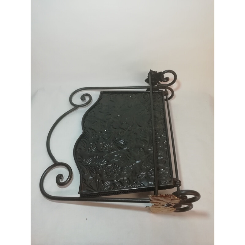 Vintage wrought iron folding magazine rack with patterned embossed interior