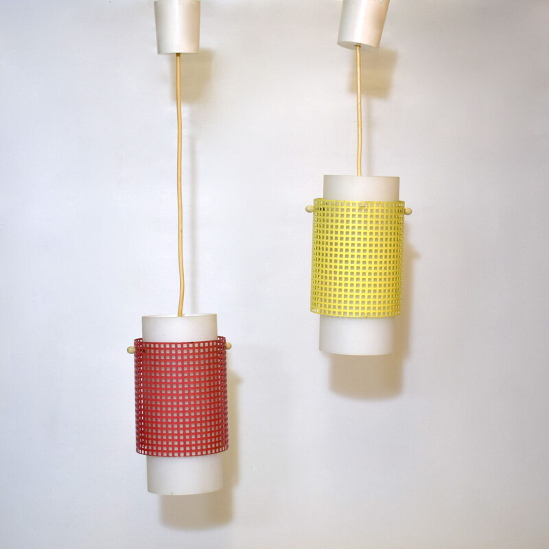 Pair of vintage red and yellow perforated metal hangers, 1950