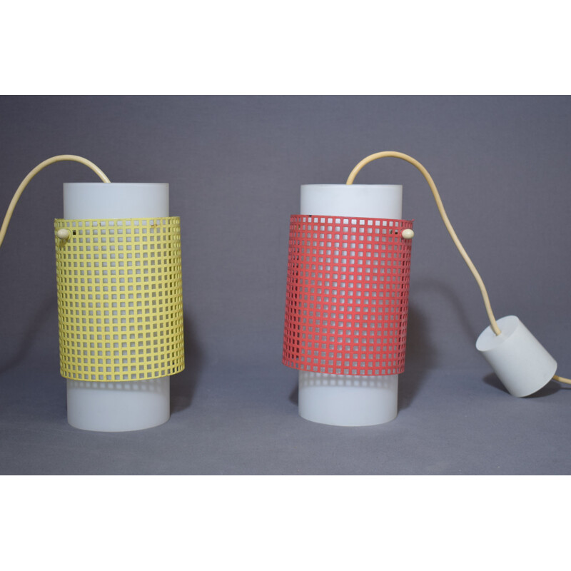 Pair of vintage red and yellow perforated metal hangers, 1950