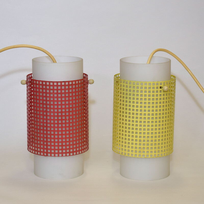 Pair of vintage red and yellow perforated metal hangers, 1950