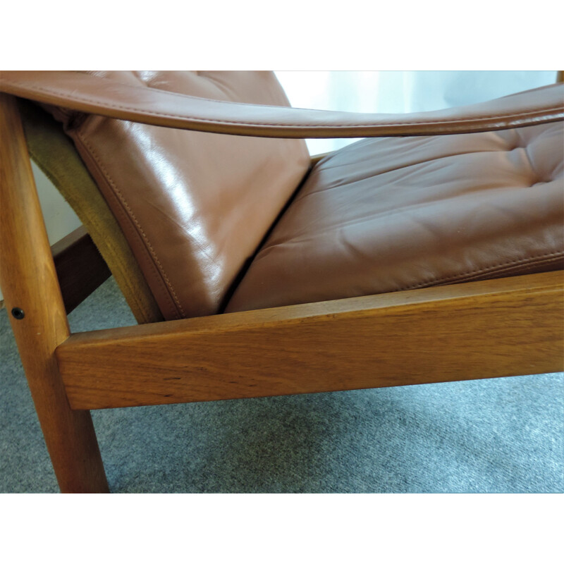Vintage leather and teak lounge armchair with danish ottoman 1960