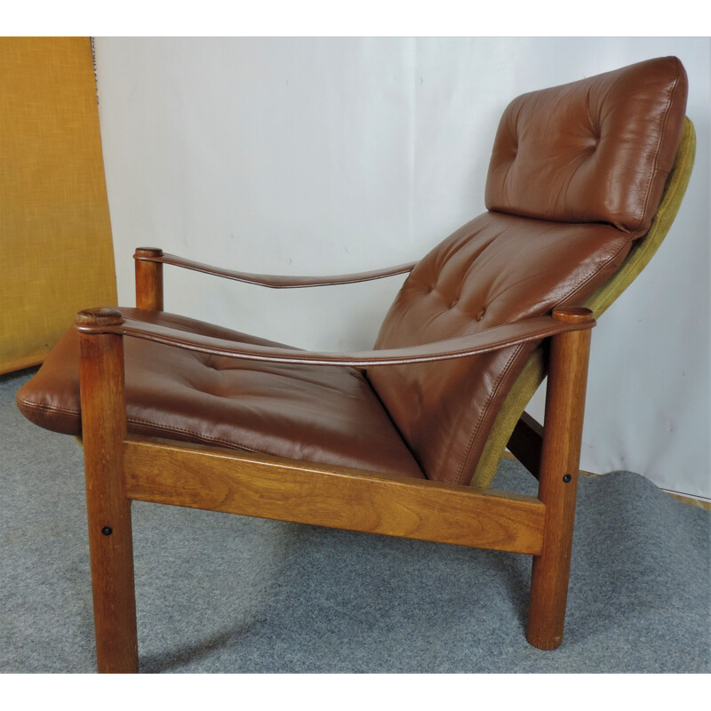 Vintage leather and teak lounge armchair with danish ottoman 1960