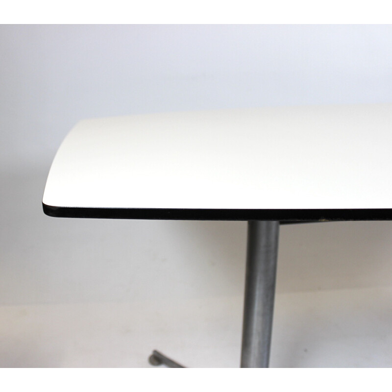 Vintage Dining table with white laminate and steel legs Charles and Ray Eames 2005