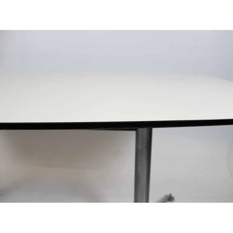 Vintage Dining table with white laminate and steel legs Charles and Ray Eames 2005