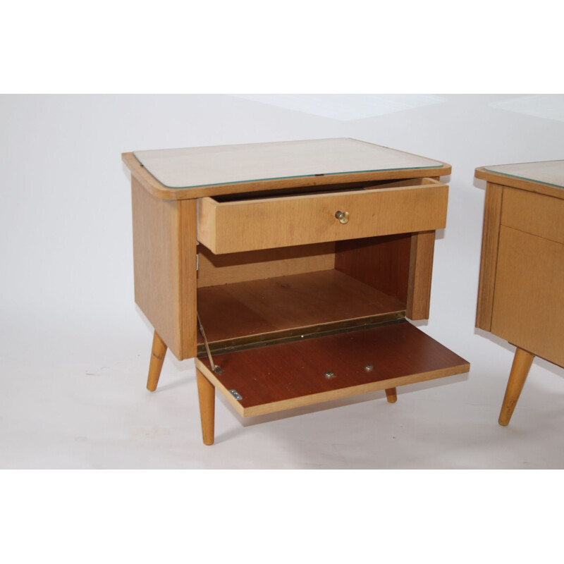 Pair of bedside tables with glass top German 1960s