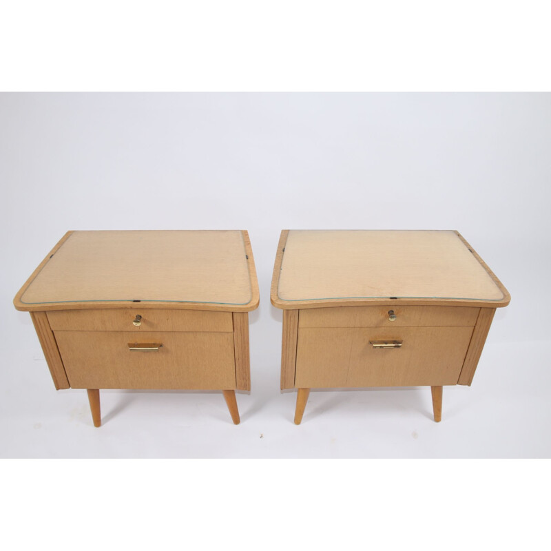 Pair of bedside tables with glass top German 1960s
