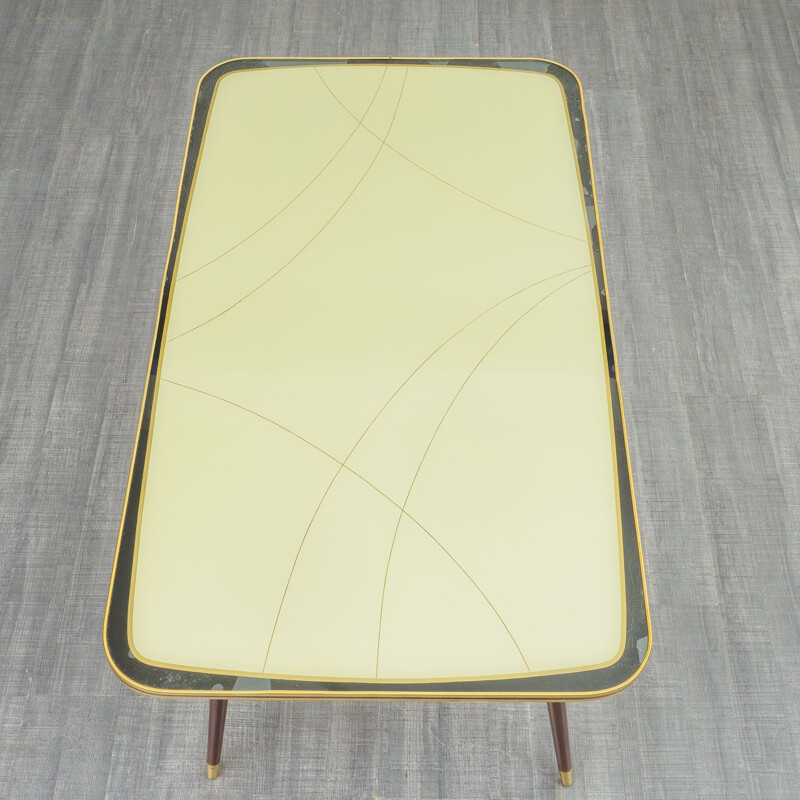 Vintage cocktail table with glass top and graphic pattern 1950s