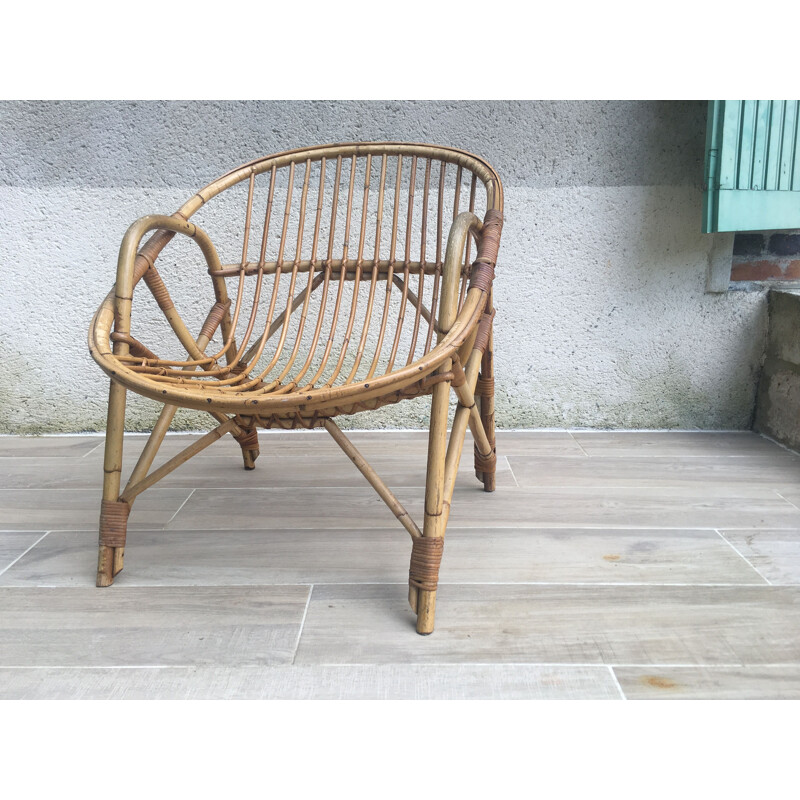 Vintage armchair Coquille in Rattan
