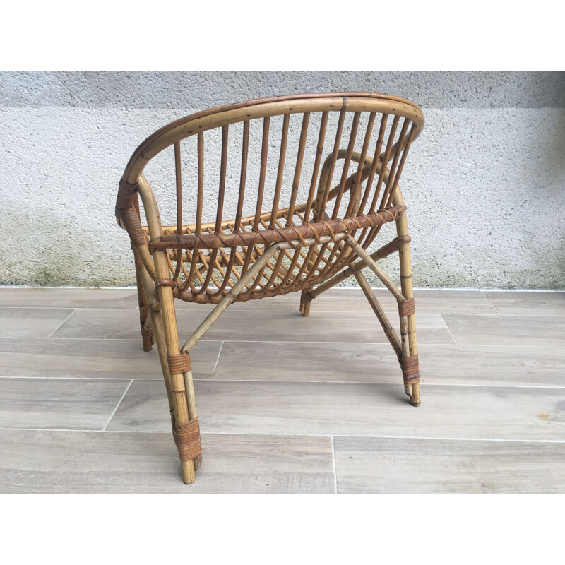 Vintage armchair Coquille in Rattan