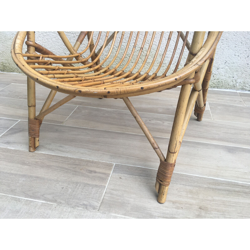 Vintage armchair Coquille in Rattan