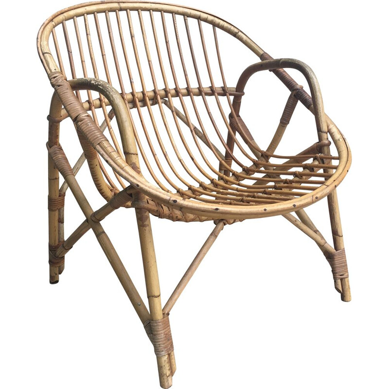 Vintage armchair Coquille in Rattan