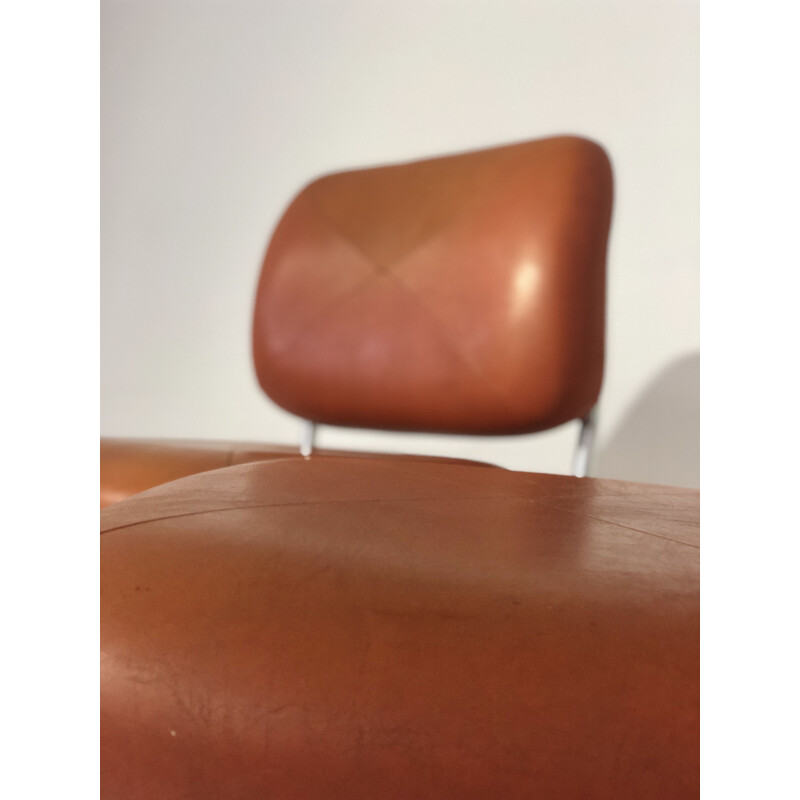 Pair of vintage orange leatherette armchairs