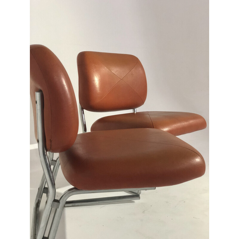 Pair of vintage orange leatherette armchairs