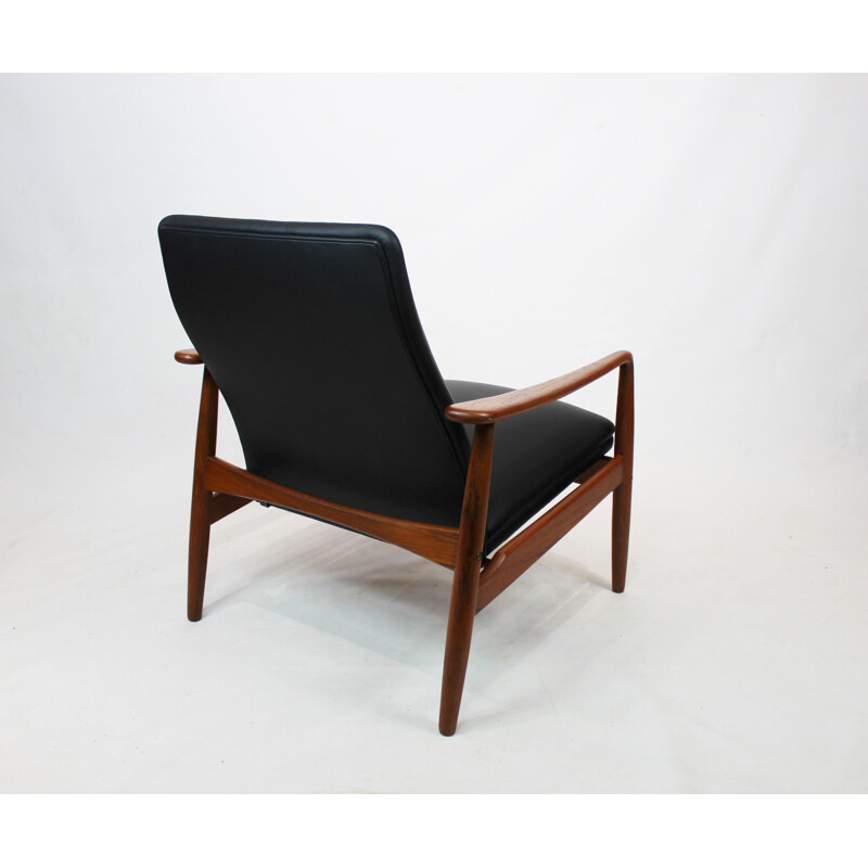Vintage Easy chair in teak and black leather designed by Søren Ladefoged 1960s