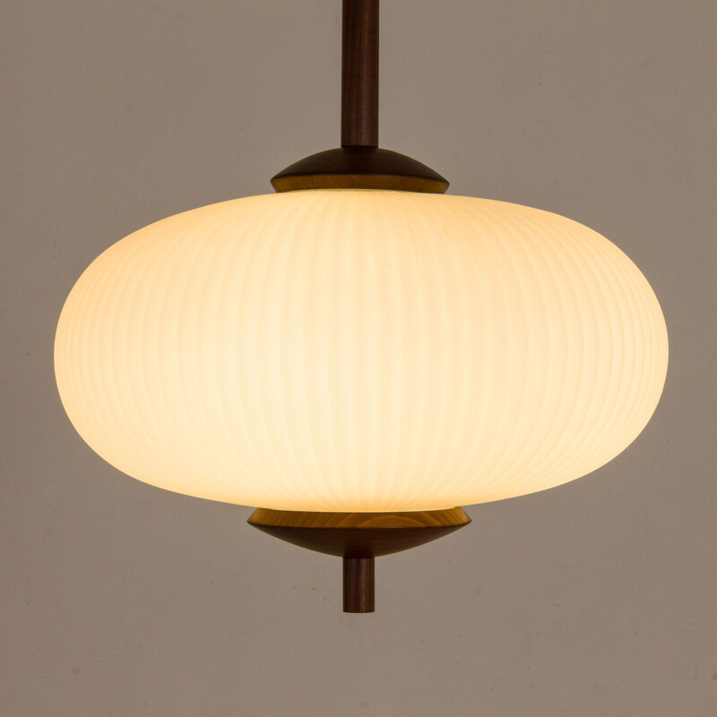 Large vintage ribbed opaline glass and teak pendant lamp of Louis Kalff, 1960s