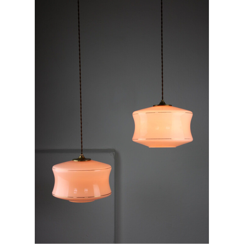 Pair of Mid-century pink glass & brass pendant lamps