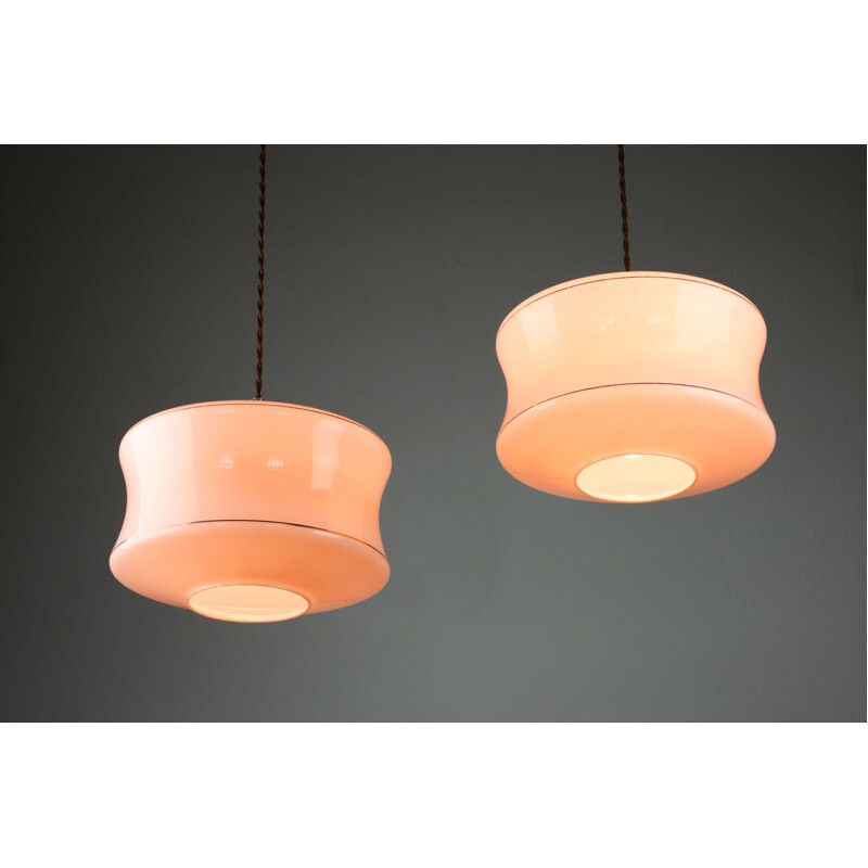 Pair of Mid-century pink glass & brass pendant lamps