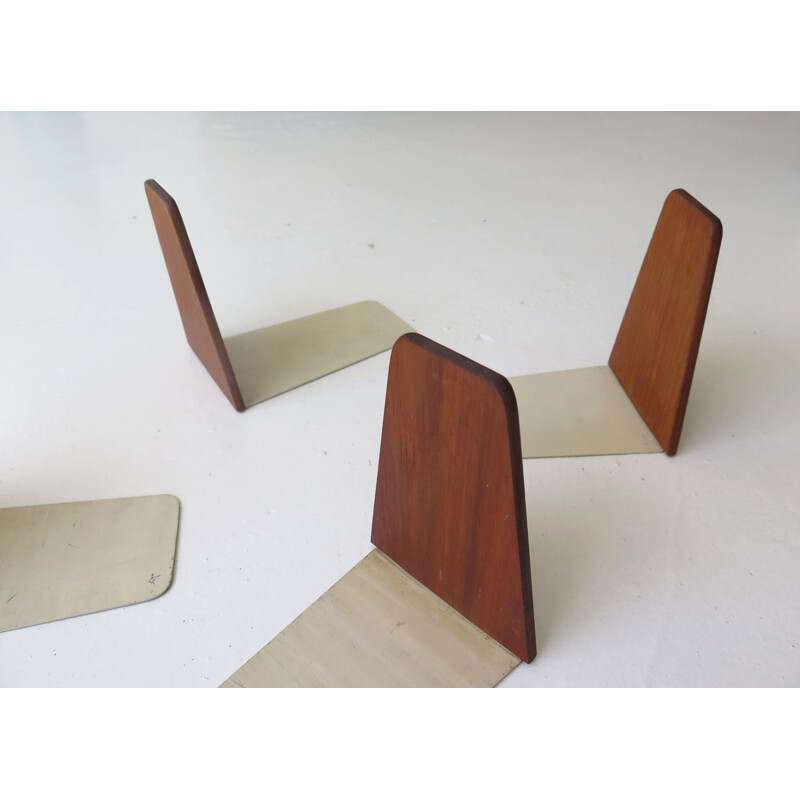 Set of 4 vintage teak and steel book stops, Danish