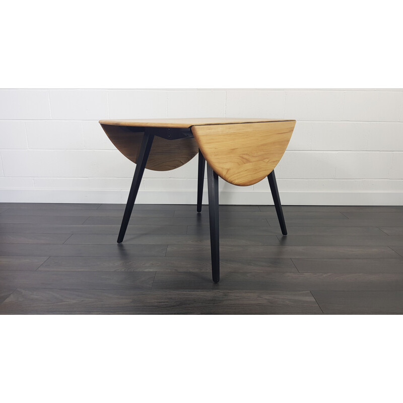 Ercol Round Drop Leaf Dining Table - Black Leg, 1960s