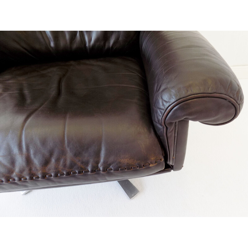 Vintage brown leather armchair De Sede with its ottoman