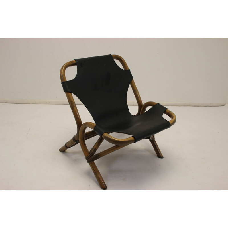 Vintage Rattan relax chair with black leather seat