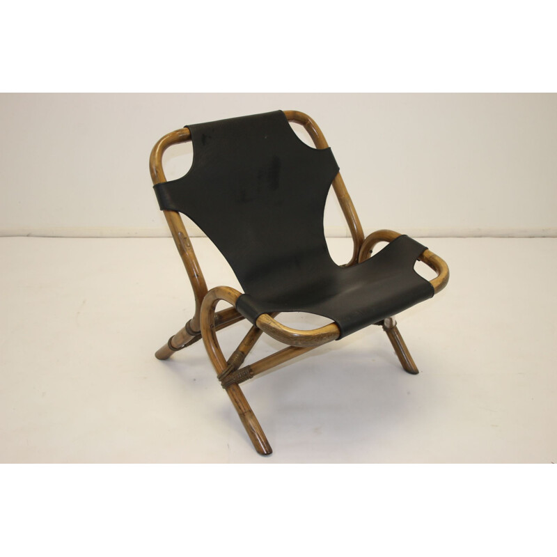 Vintage Rattan relax chair with black leather seat