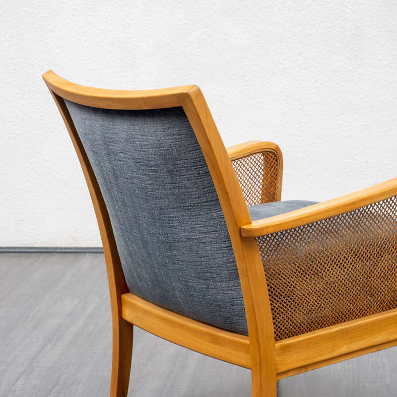 Vintage cherryvwood armchair with bast armrests 1950s