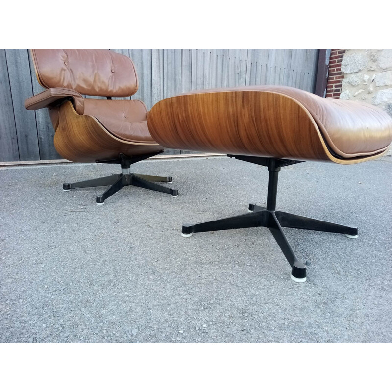 Lounge chair and brown ottoman by Charles Eames for Mobilier International 1990