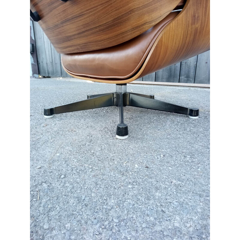Lounge chair and brown ottoman by Charles Eames for Mobilier International 1990