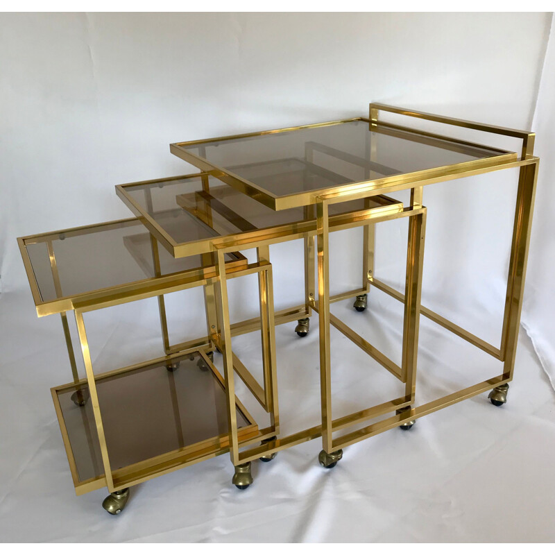 Vintage nesting tables with brass and smoked glass casters, Italy 1970