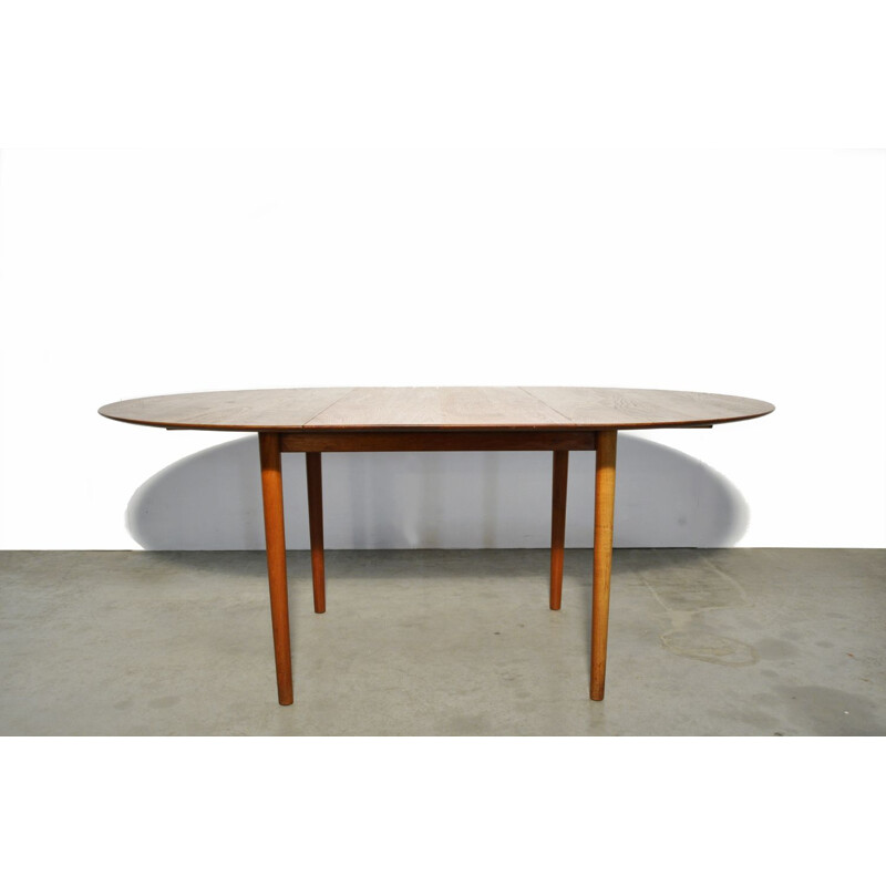 Vintage round extendable teak dining table  Danish 1950s