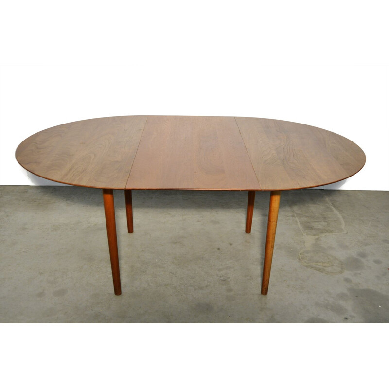 Vintage round extendable teak dining table  Danish 1950s