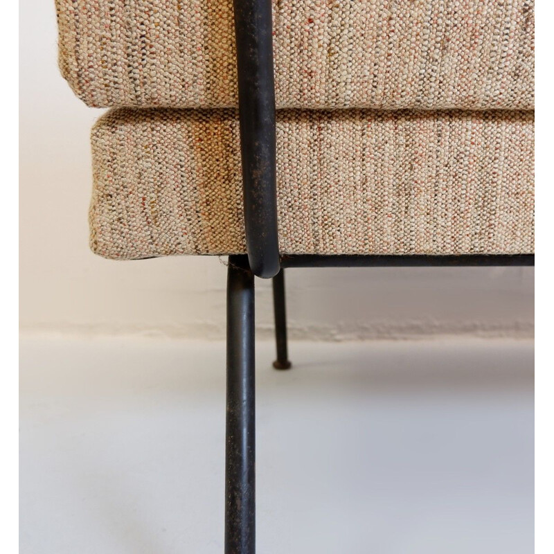 Vintage tubular structure in a black Italian metal couch
