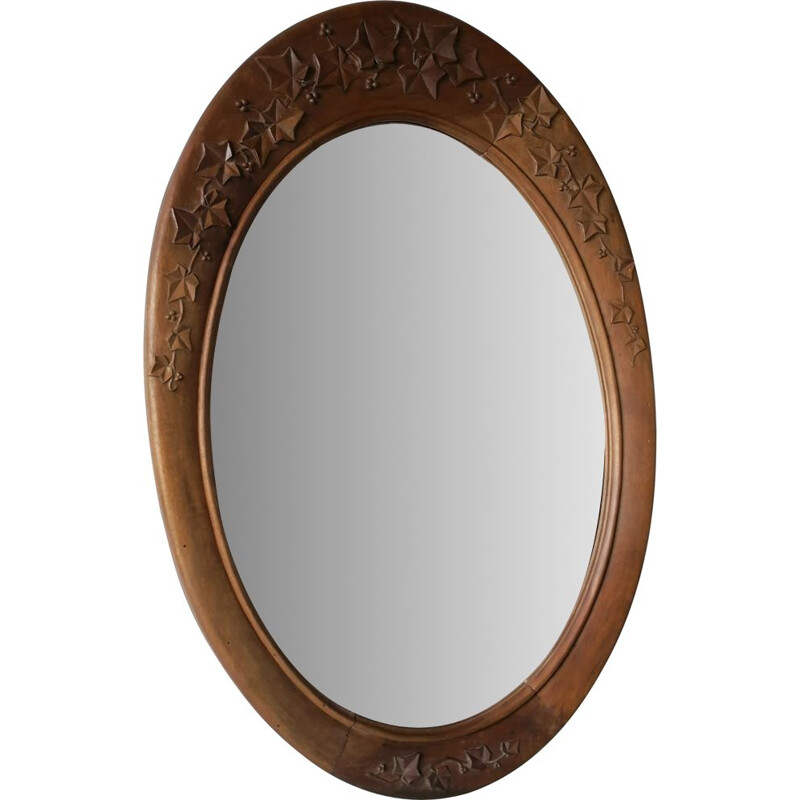 Vintage oval mirror with carved wood frame