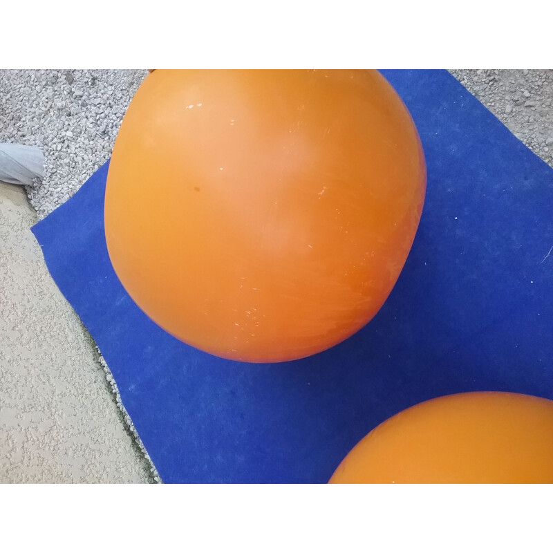 Pair of vintage orange plastic pouffes