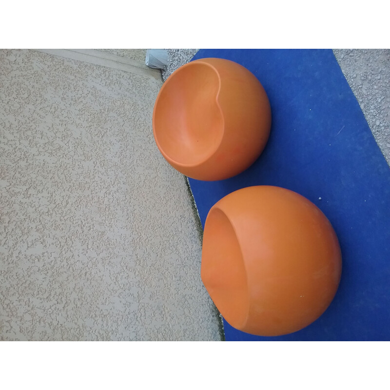 Pair of vintage orange plastic pouffes